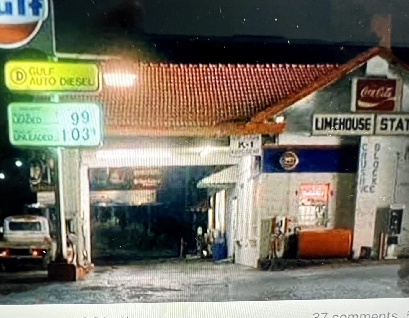 A gas station with a lot of signs on it